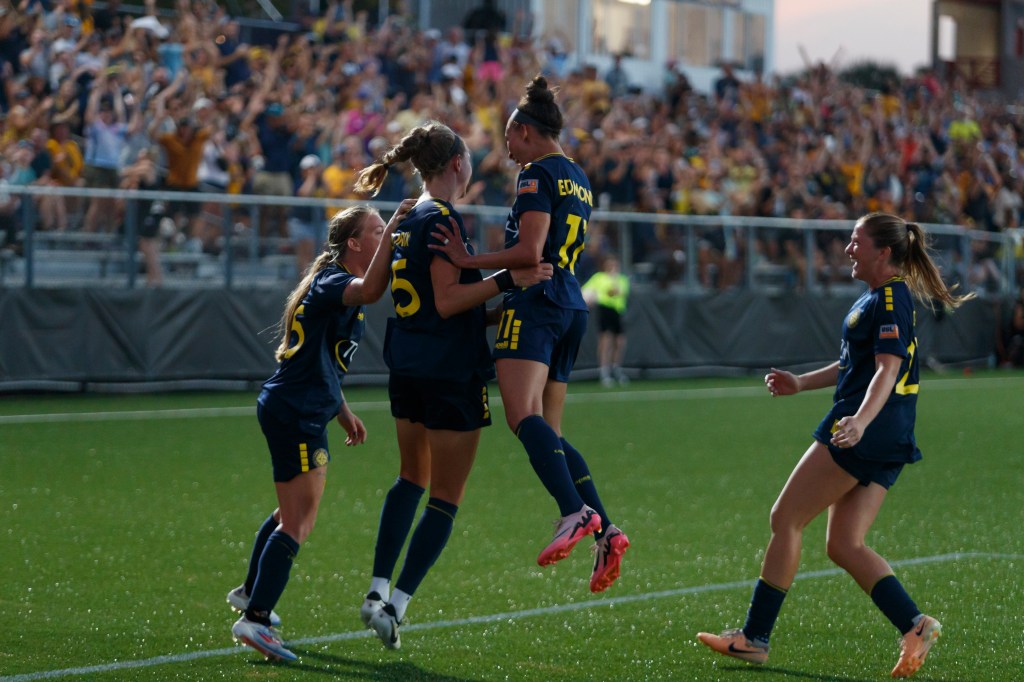 Tampa Bay Sun FC players celebrating a goal in their opening match.