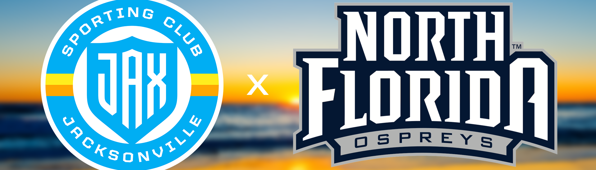 Sporting JAX and University of North Florida Ospreys logos stand together in front of a sunrise on the beach.