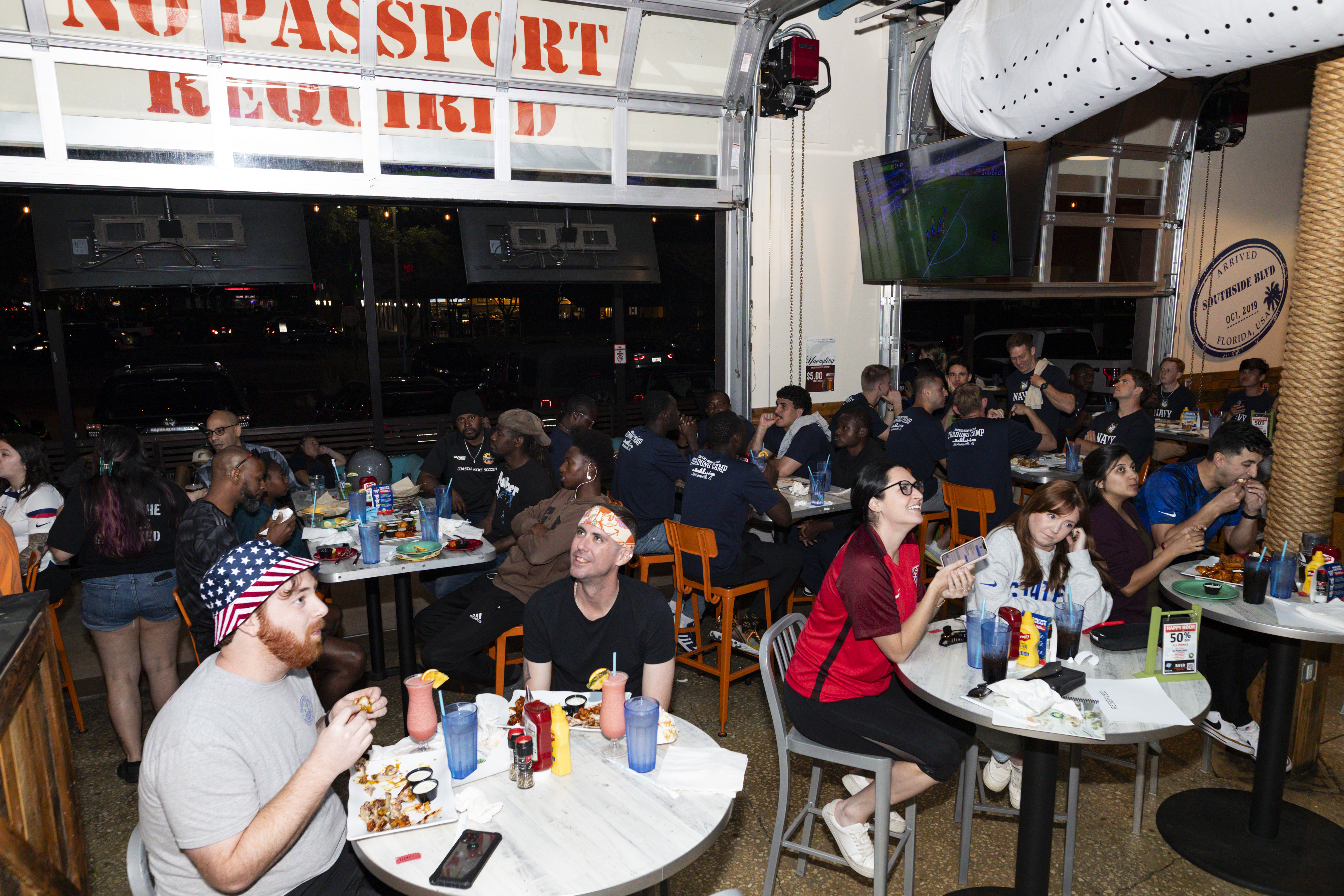 Fans cheer on the USMNT at a watch party in March