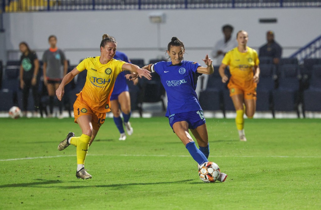 Players from Tampa Bay Sun FC and Fort Lauderdale United FC battle for the ball.